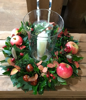 Autumn table centrepiece with hurricane vase and candle